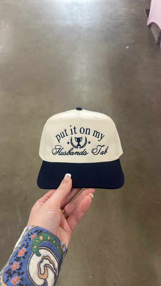 “Put It On My Husband’s Tab” Trucker Hat